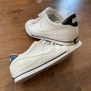 Women’s white Nike sneakers